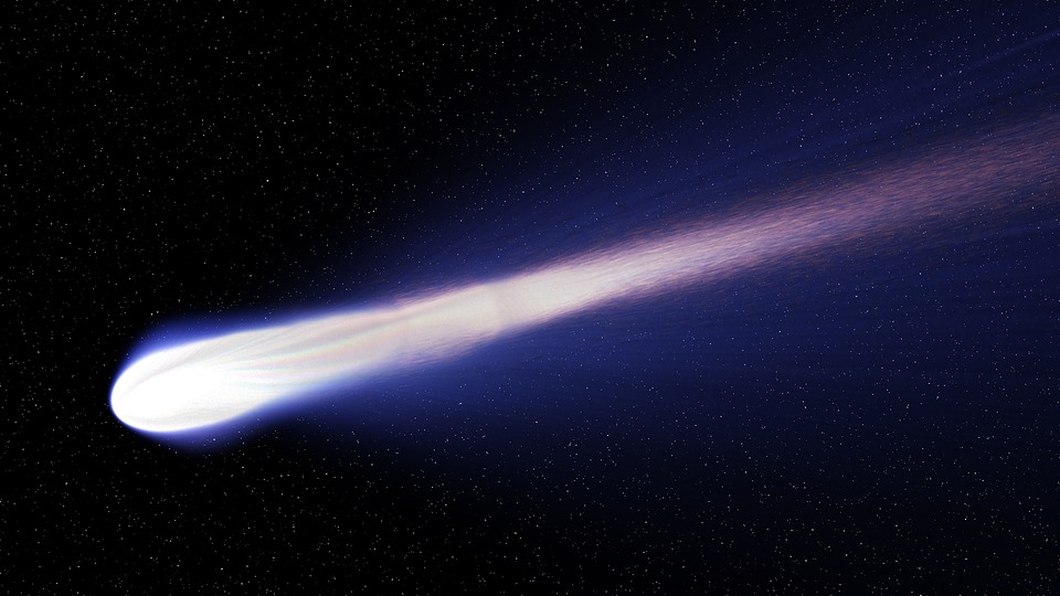 A purplish-white comet streaking through the sky.